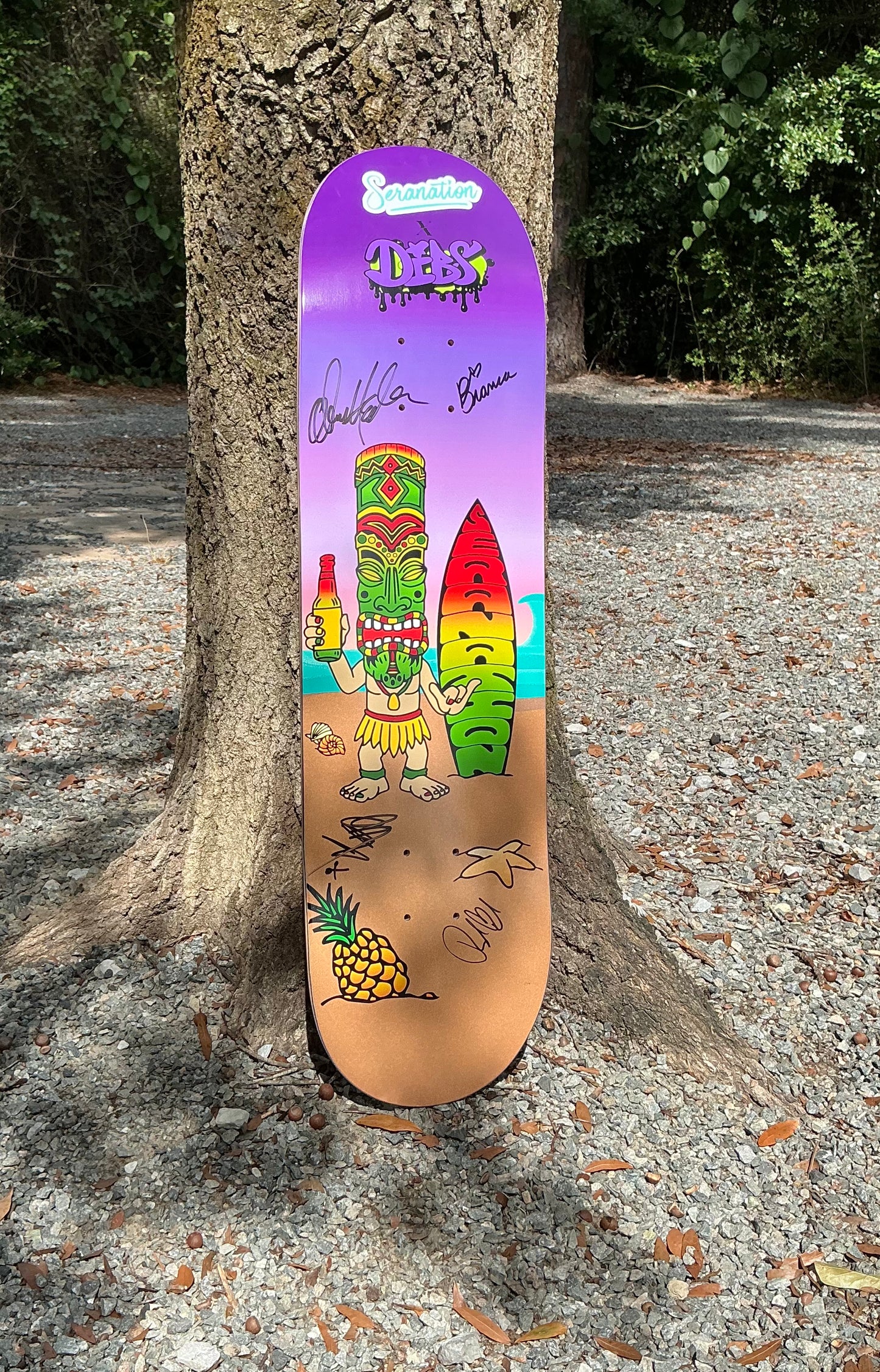 Seranation tiki man SIGNED skateboard